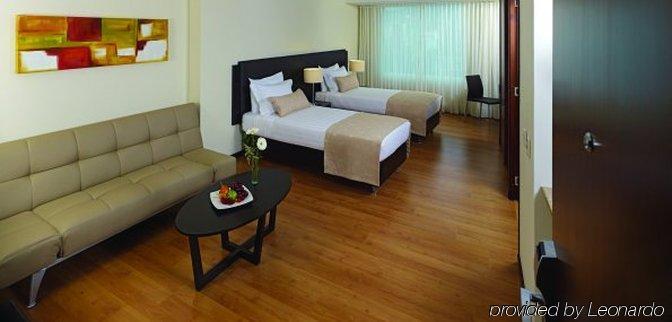 Estelar Apartamentos Medellín Pokoj fotografie